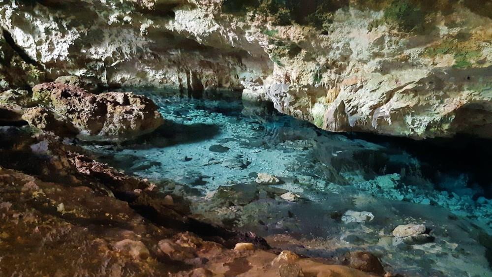 Natural swimming pool inside Kuza Cave, Zanzibar