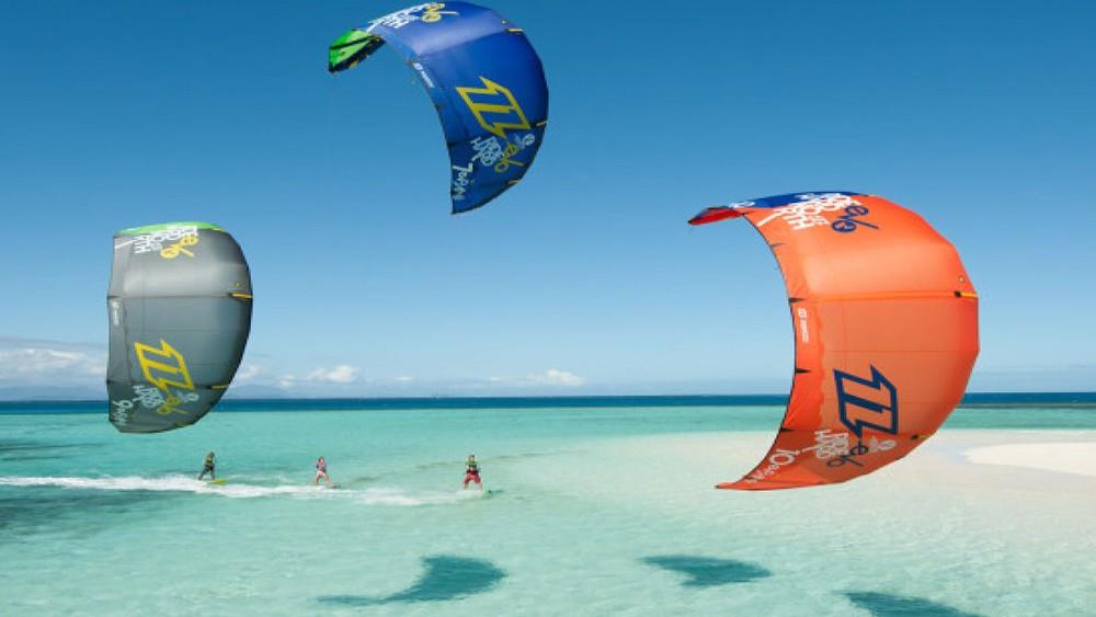 Colourful kites over the turquoise ocean at Paje beach