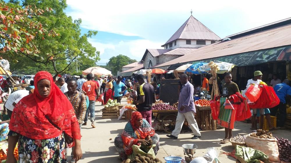 Busy outdoor produce market in Stone Town, Zanzibar